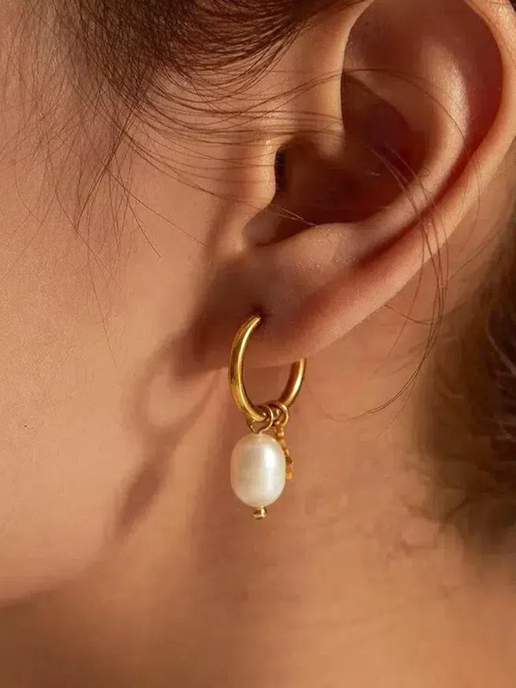 Parel oorbellen met ster - Klassiek en speels ontwerp